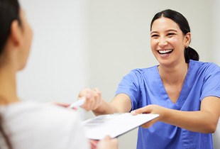 Patient in Arcadia reviewing insurance and financing options for teeth whitening