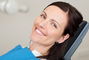 Smiling woman in dental char