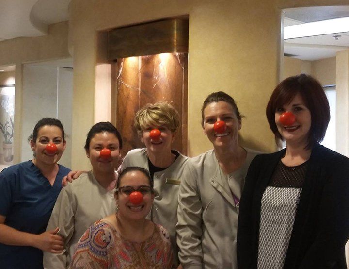 Team members celebrating red nose day