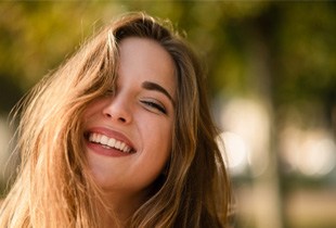 Woman smiling with dental crown