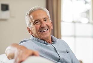 man smiling after getting dental implants in Arcadia