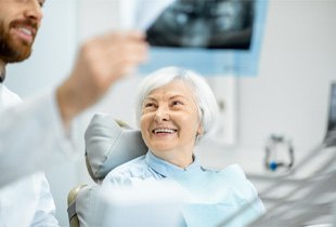 patient smiling after getting dental implants in Arcadia