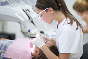 Dentist treating patient