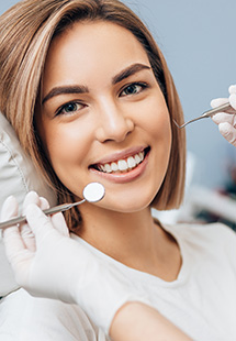 woman smiling during dental exam in Sierre Madre