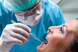 Woman recieving oral cancer screening