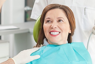 Smiling older woman in dental chair