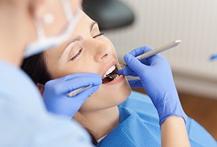 Woman receiving dental exam