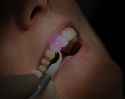 Patient receiving laser dentistry