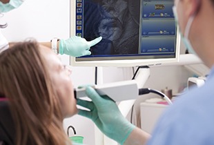 Dentist and patient looing at digital impressions