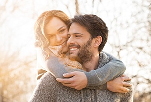 Smiling couple with tooth-colored fillings in Arcadia 