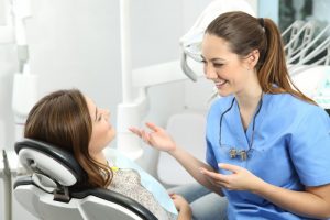 dental hygienist in Arcadia chatting with a patient 