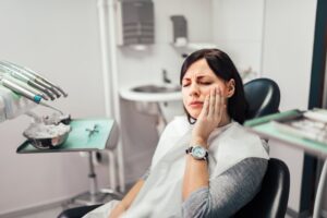 Woman at her dentist with a toothache