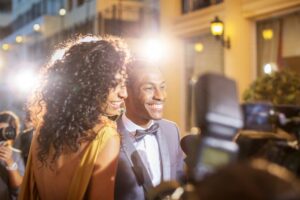 Two people with perfect smiles having their picture taken