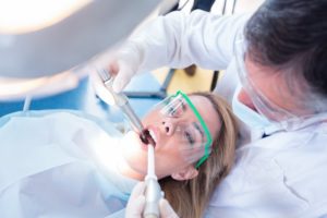 dentist near San Marino treating young female patient 