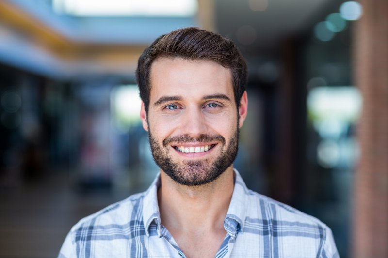 person wearing temporary veneers smiling