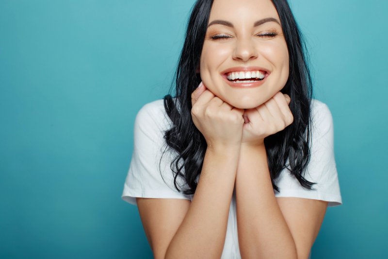 Woman smiling with straight, white teeth