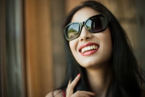 Smiling woman with beautiful teeth thanks to the Arcadia cosmetic dentist